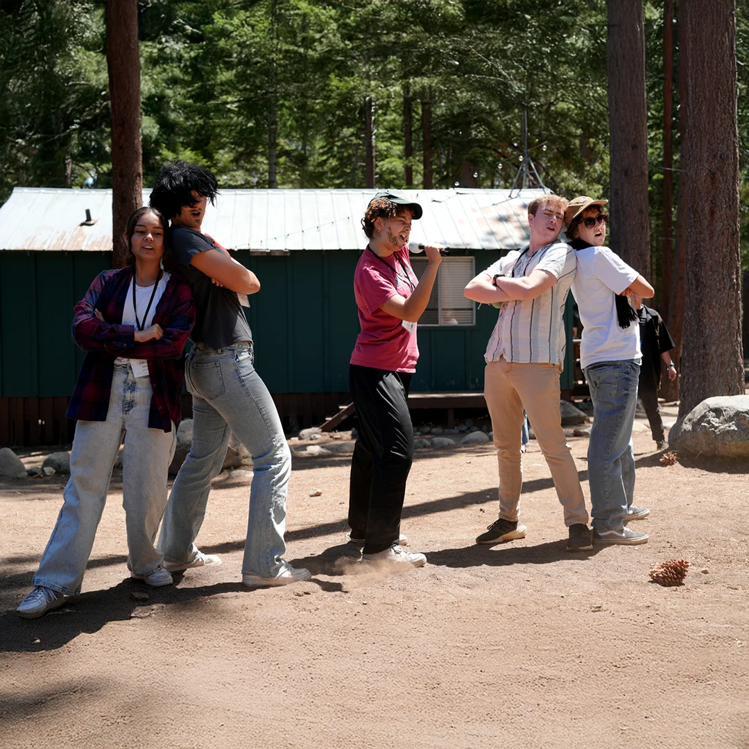 Campers Striking Fun Poses Outdoors