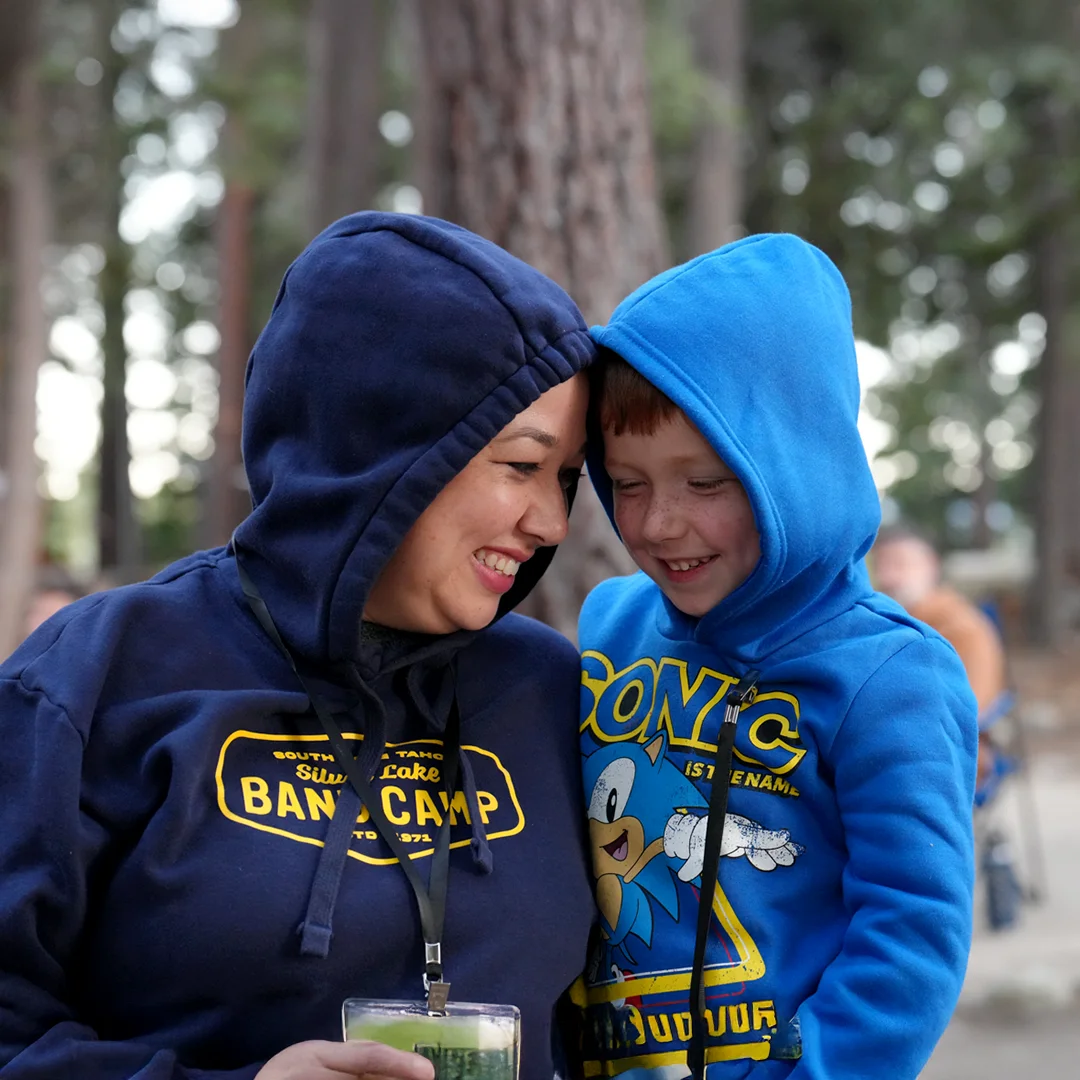 Parent And Camper Sharing A Warm Moment Parent And Camper Sharing A Warm Moment