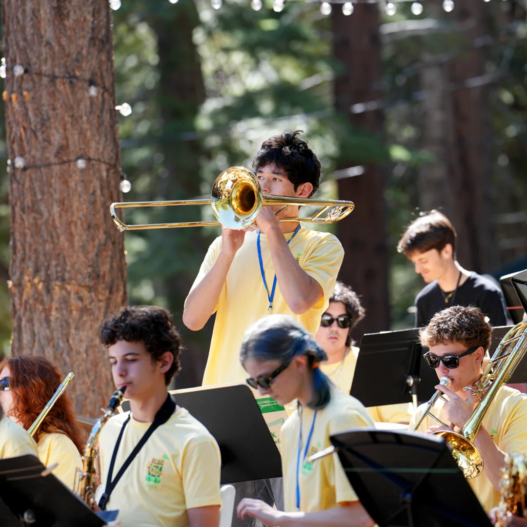 Trombone Player Leading Outdoor Ensemble