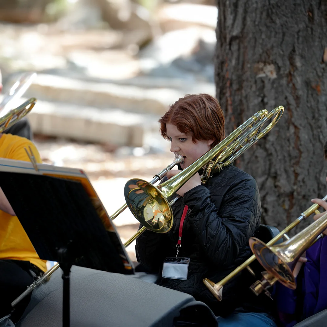 Trombone Player In Outdoor Rehearsal